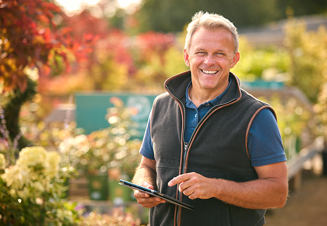 portrait-of-mature-man-working-outdoors-in-garden